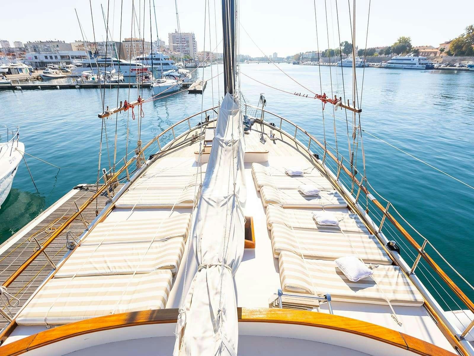 a large ship in a harbor aboard Gulet Gardelin Yacht for Charter