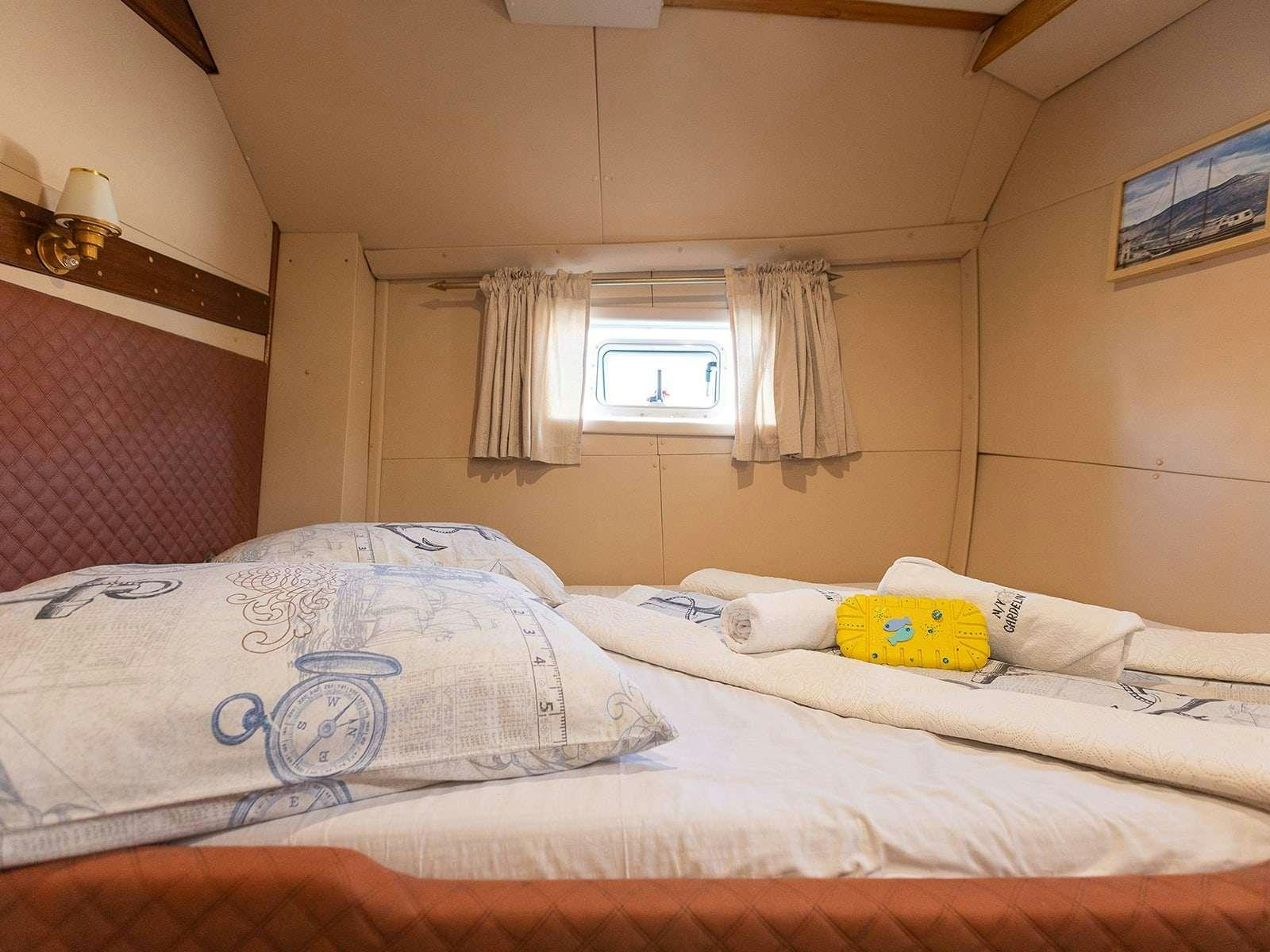 a couple of beds in a room aboard Gulet Gardelin Yacht for Charter