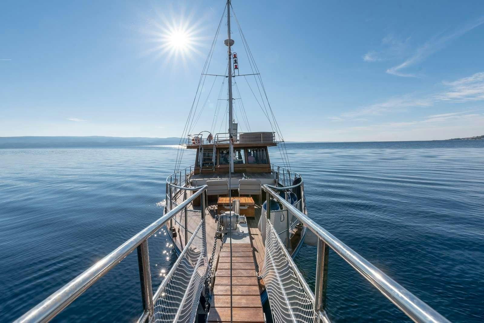 a boat on a body of water aboard Trebenna Yacht for Charter