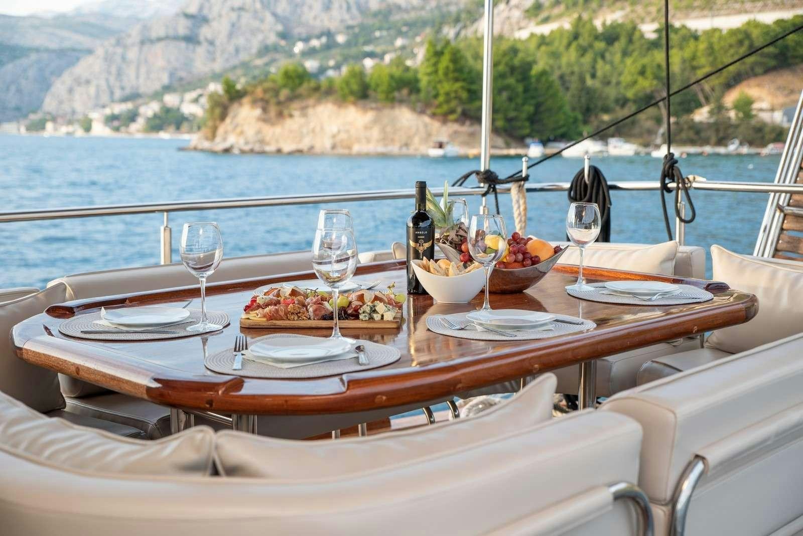 a table with food on it aboard Trebenna Yacht for Charter