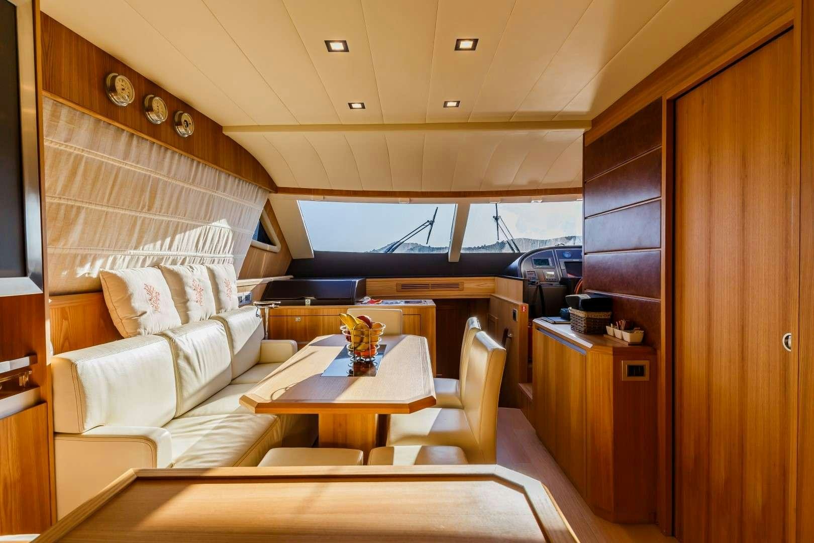 a room with a table and chairs aboard SECRET LIFE Yacht for Charter