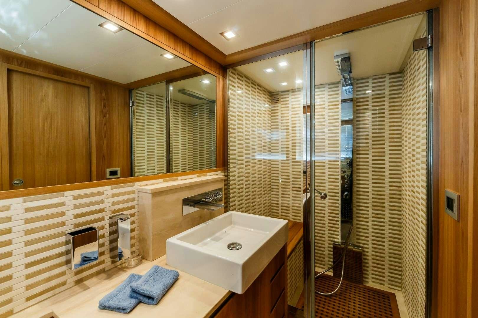 a bathroom with a sink and shower aboard SECRET LIFE Yacht for Charter