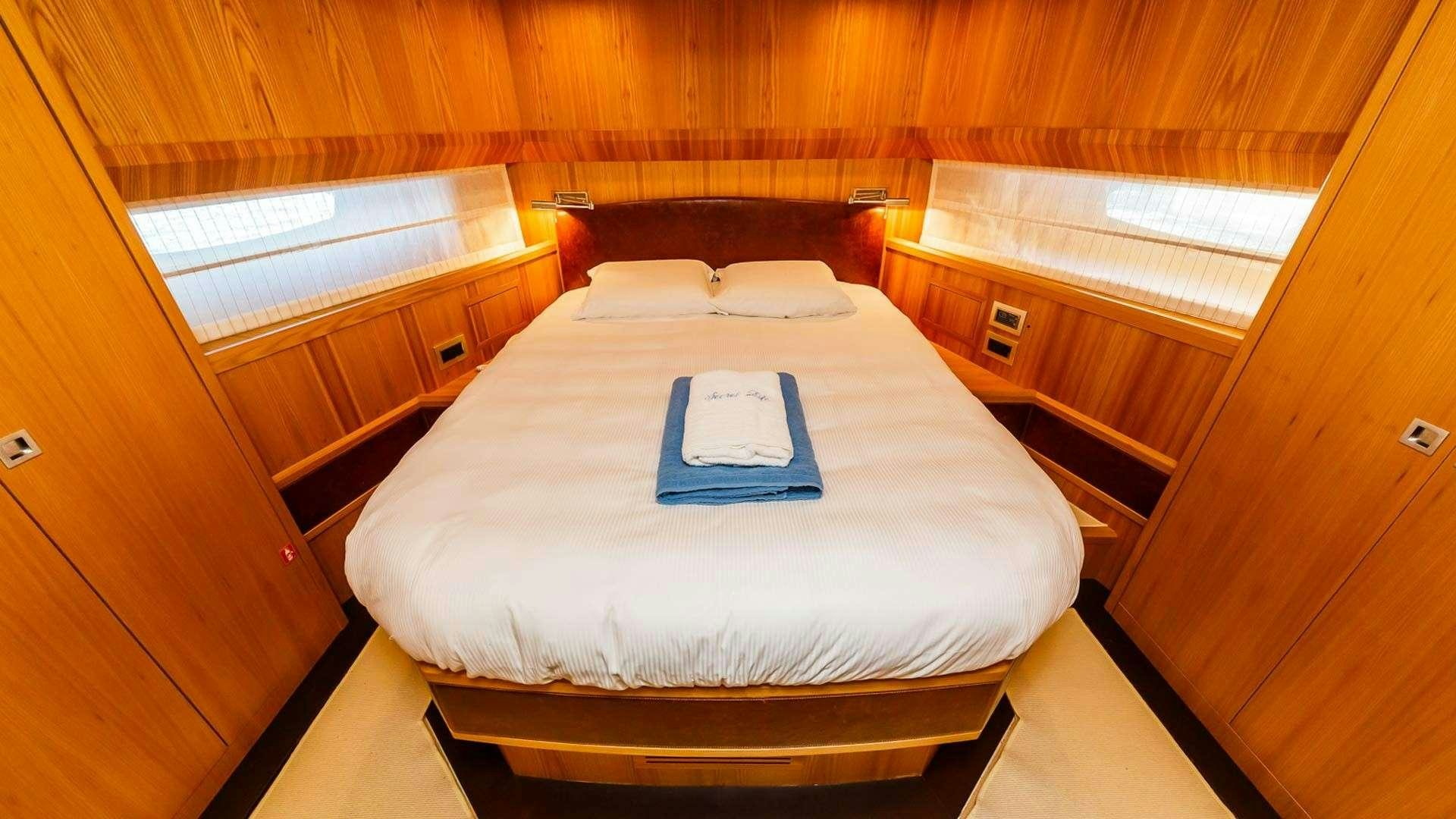 a bed in a room aboard SECRET LIFE Yacht for Charter