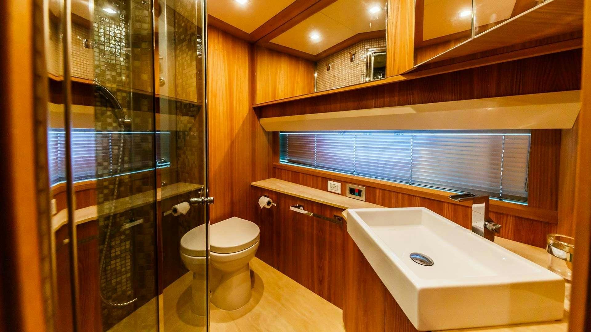 a bathroom with a glass shower aboard SECRET LIFE Yacht for Charter