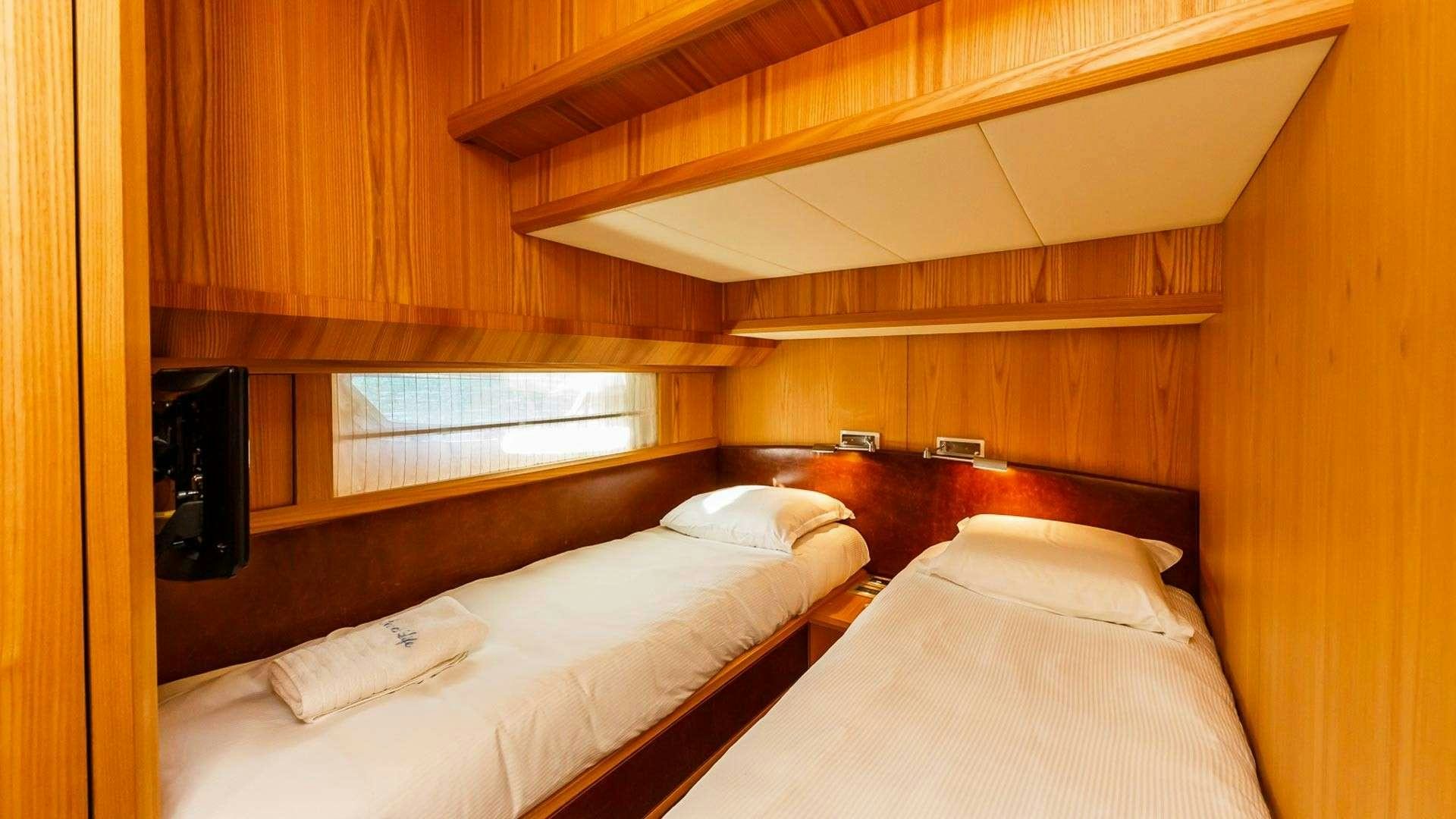 two beds in a room aboard SECRET LIFE Yacht for Charter