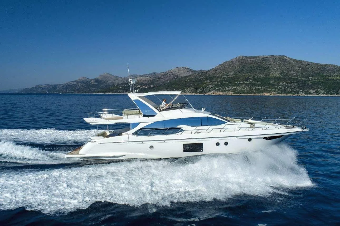 a white boat on the water aboard TAMARA II Yacht for Charter