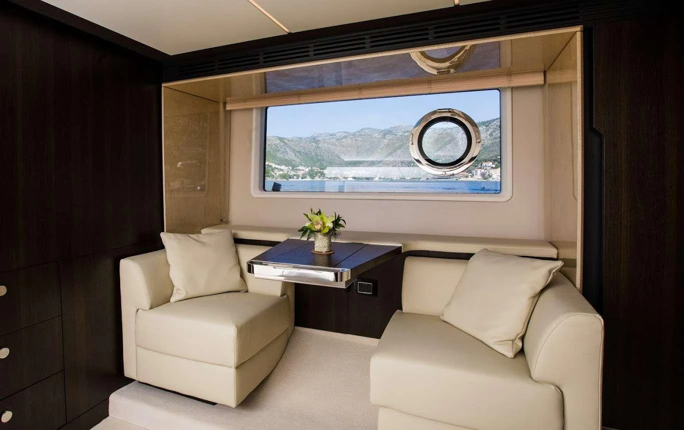 a room with a couch and a table aboard TAMARA II Yacht for Charter
