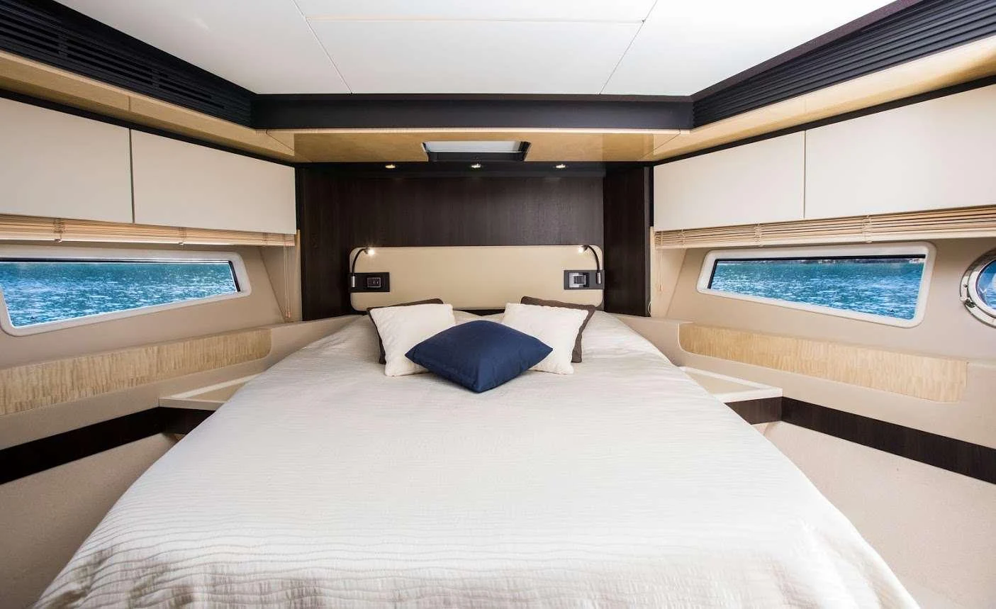 a room with a bed and a window aboard TAMARA II Yacht for Charter