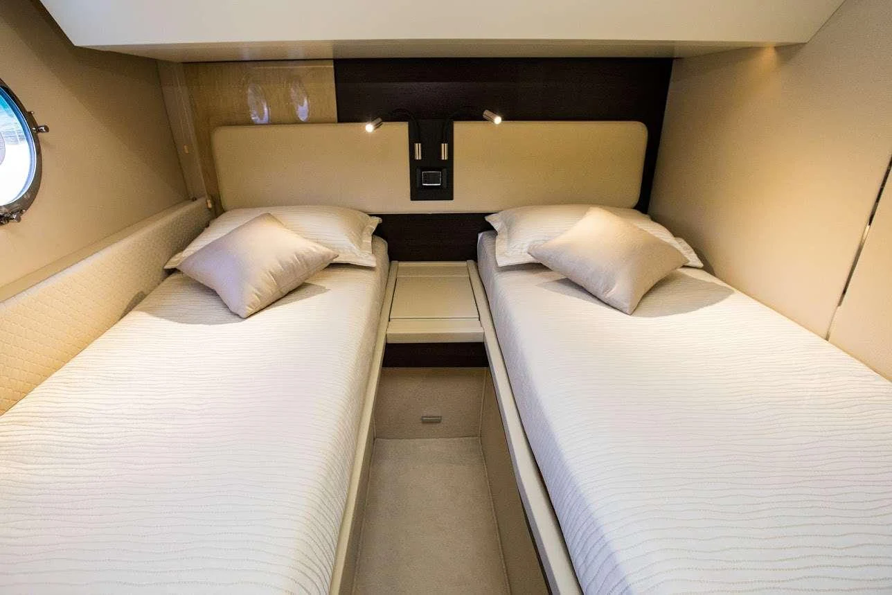 a couple of beds in a room aboard TAMARA II Yacht for Charter