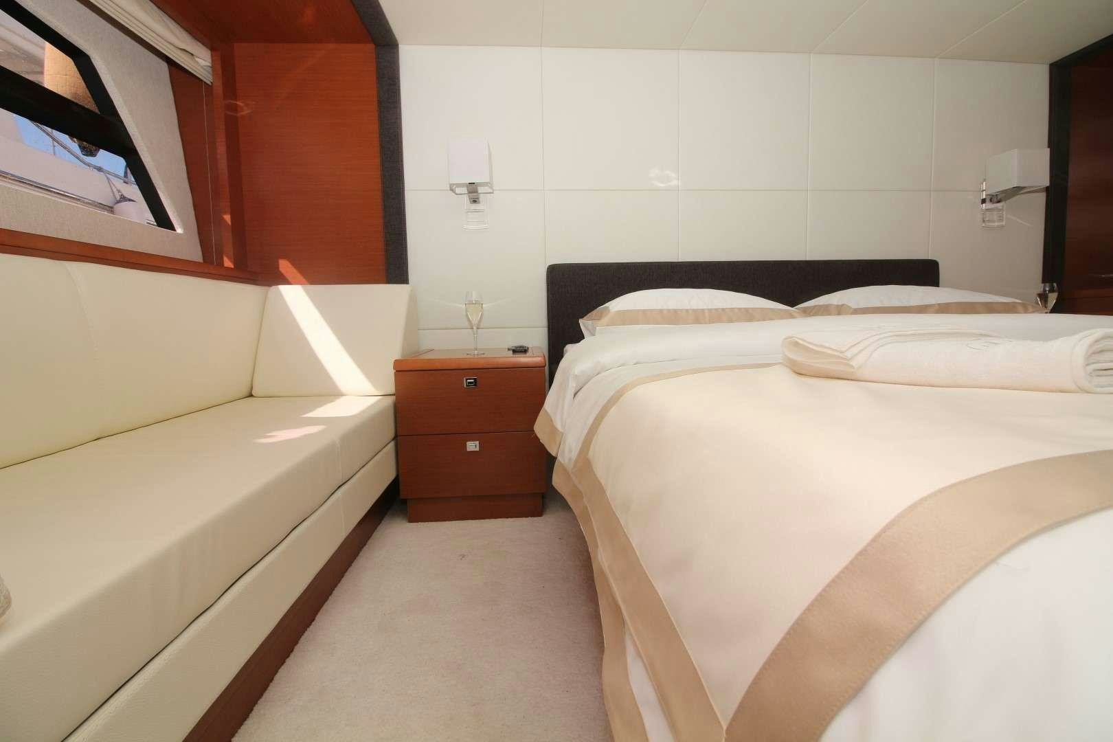 a room with two beds aboard GRACE Yacht for Charter