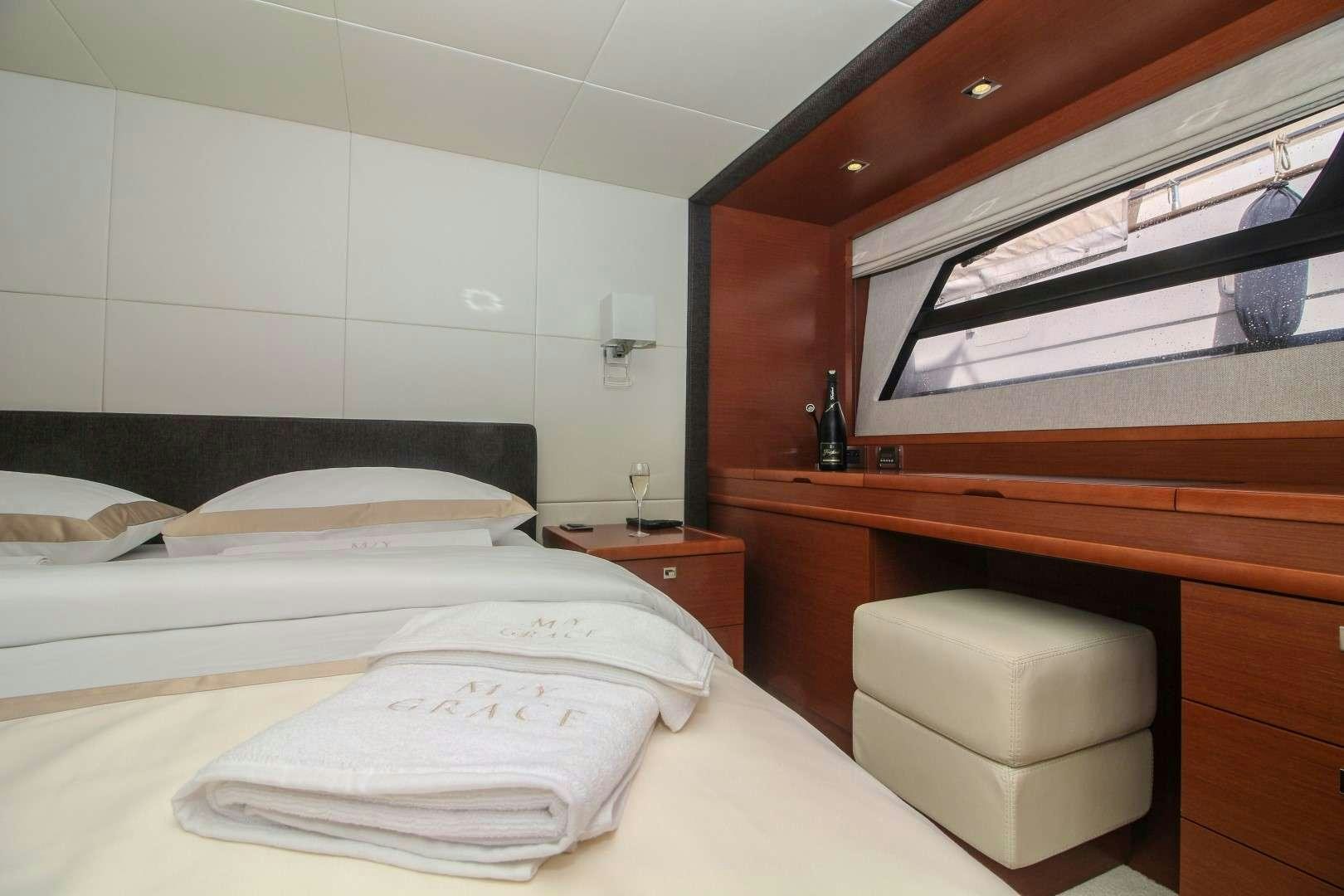 a room with two beds aboard GRACE Yacht for Charter