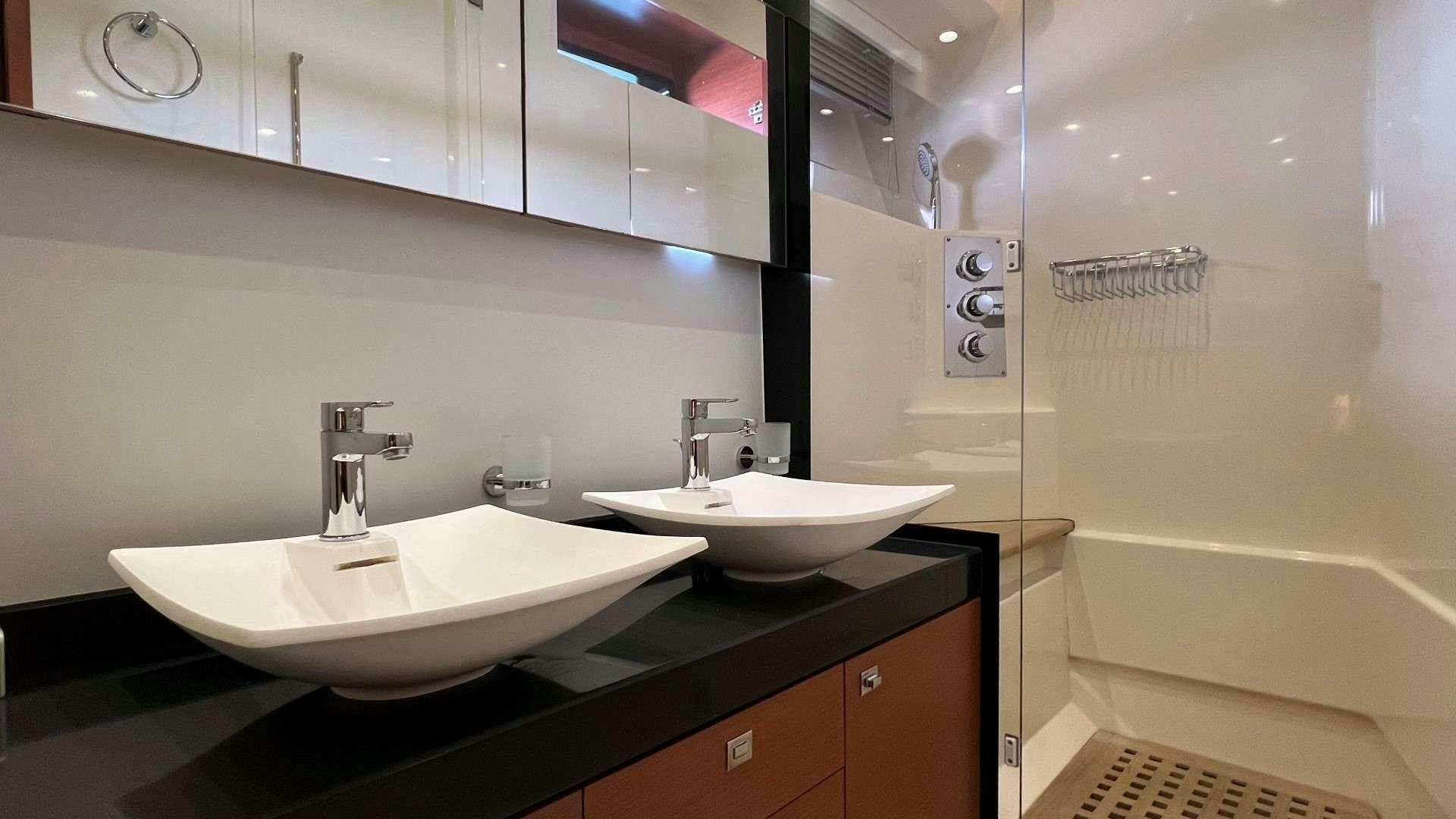 a bathroom with two sinks aboard GRACE Yacht for Charter