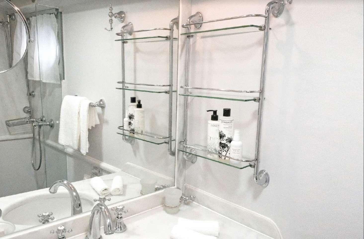 a bathroom with a sink and a mirror aboard CALLISTO Yacht for Charter