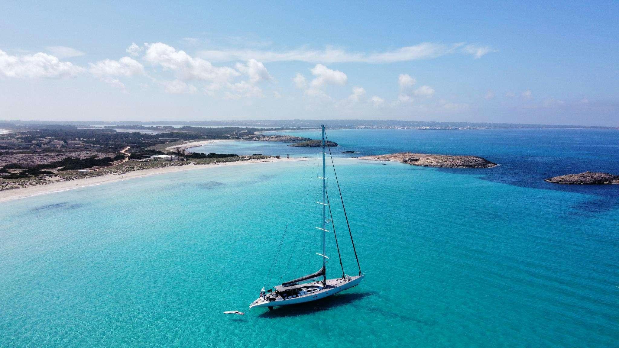 a sailboat in the ocean aboard AIZU Yacht for Charter