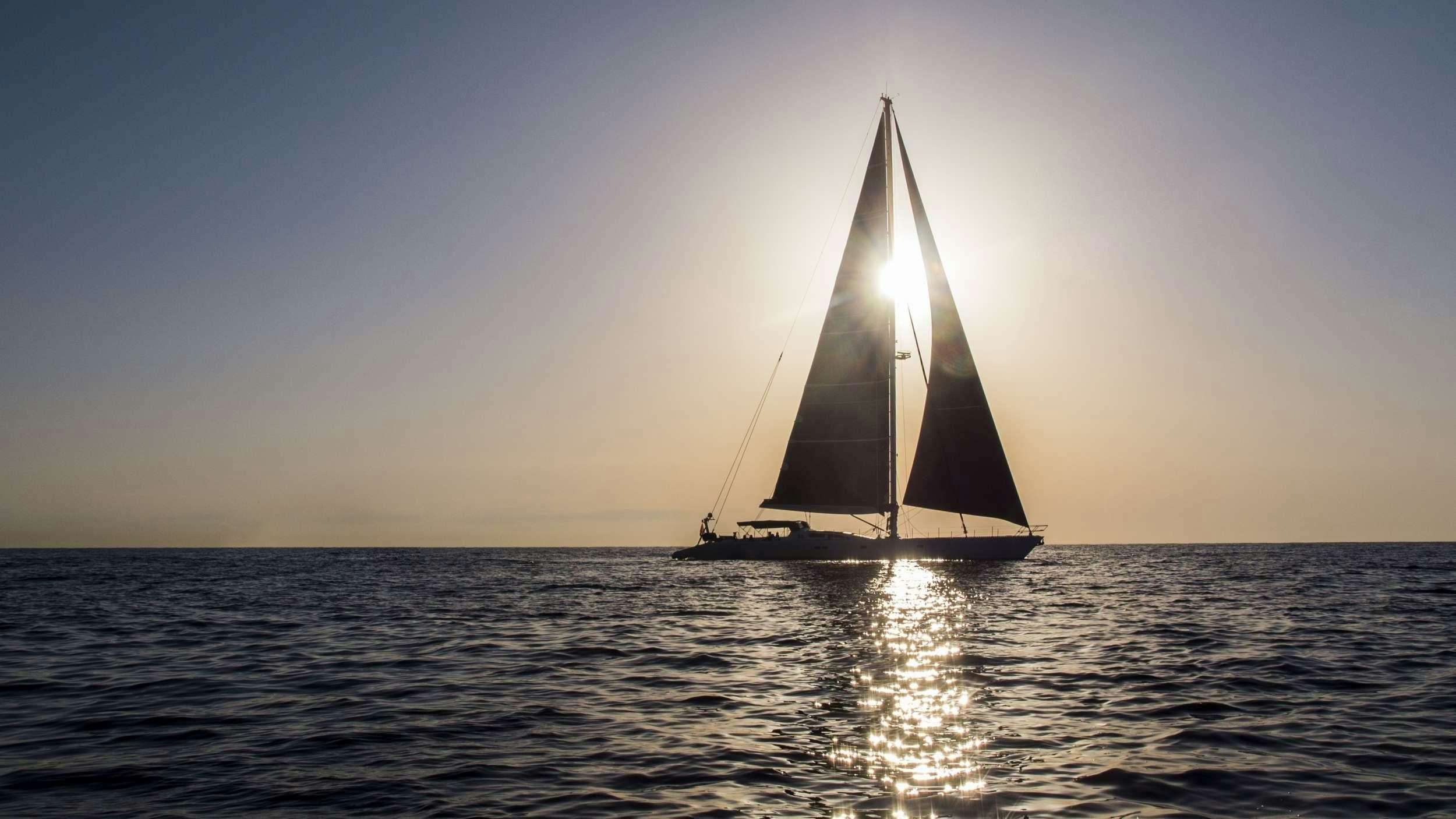 a sailboat on the water aboard AIZU Yacht for Charter