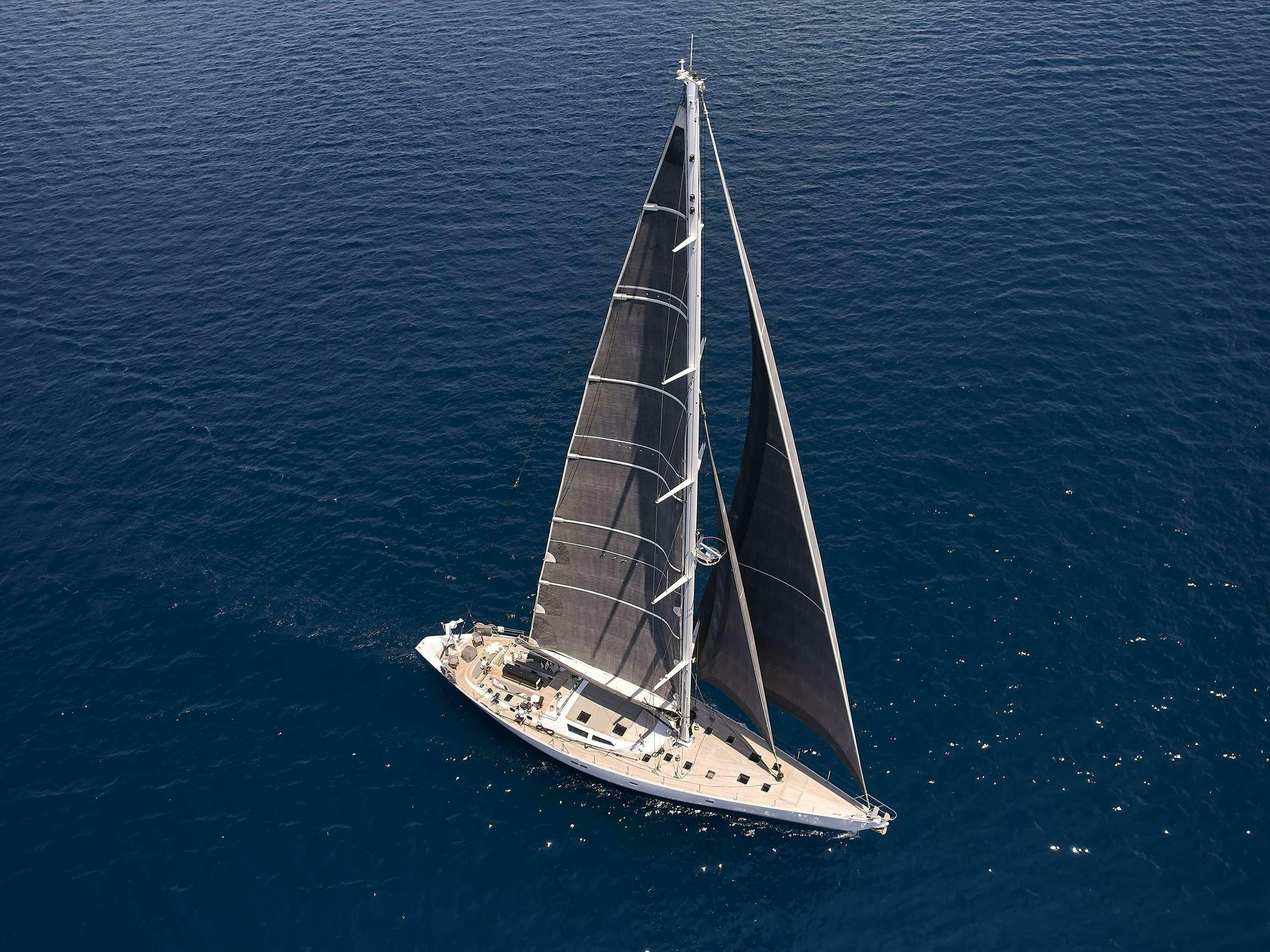 a sailboat in the water aboard AIZU Yacht for Charter