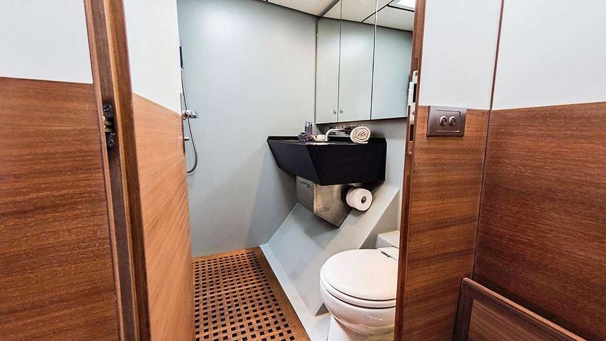 a bathroom with a sink and toilet aboard AIZU Yacht for Charter