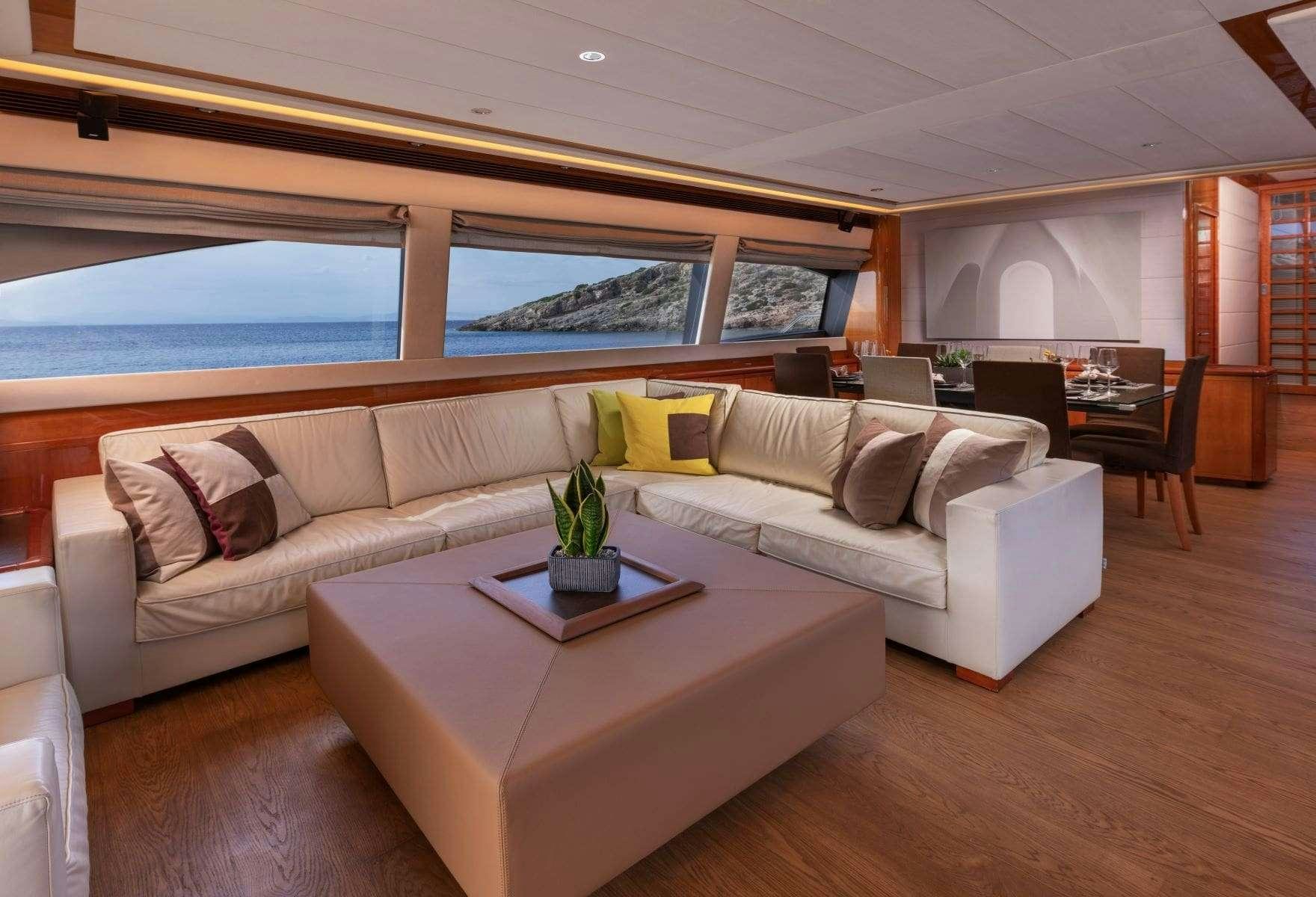 a living room with a couch and a table aboard ANNOUKA Yacht for Charter
