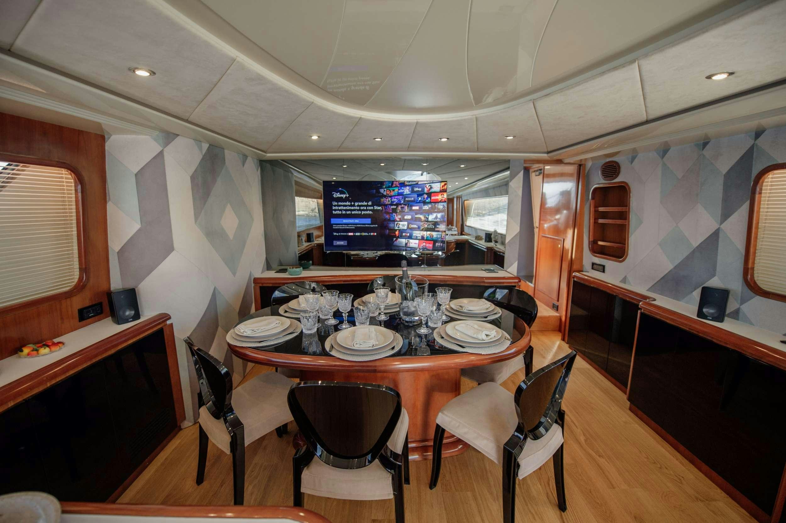 a dining table in a restaurant aboard BEYOND Yacht for Charter