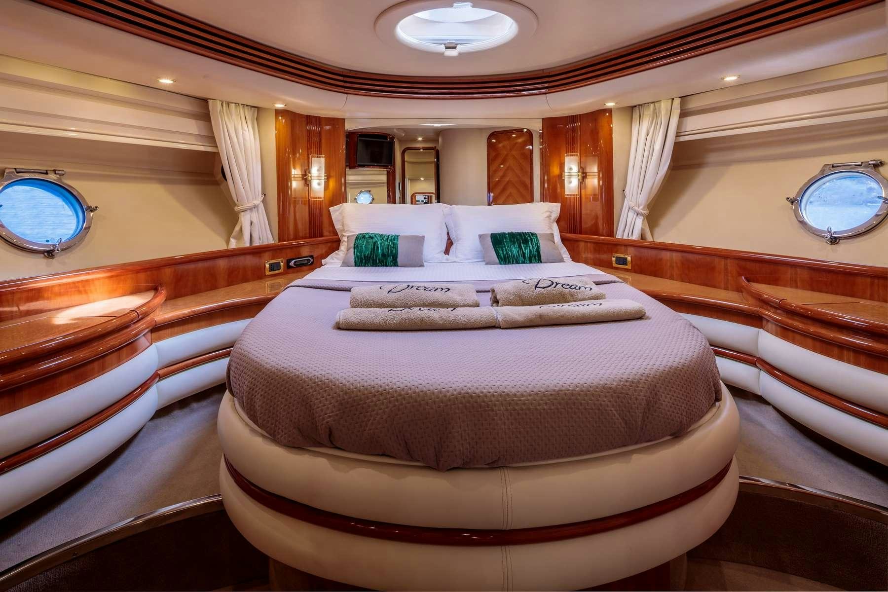 a large bed in a hotel room aboard DREAM Yacht for Charter