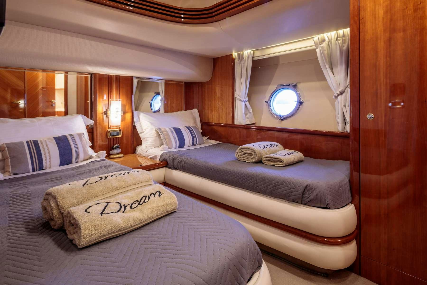a room with two beds aboard DREAM Yacht for Charter