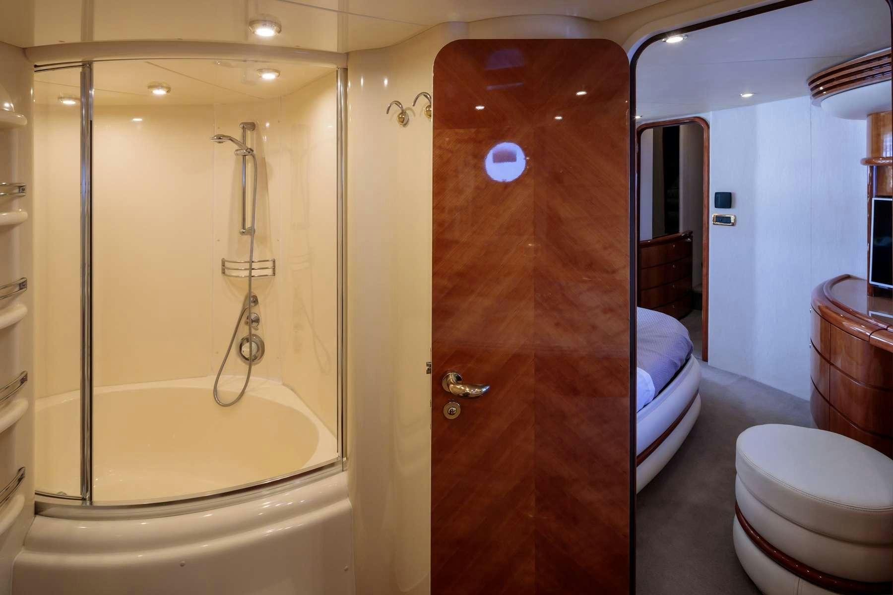 a bathroom with a shower and toilet aboard DREAM Yacht for Charter