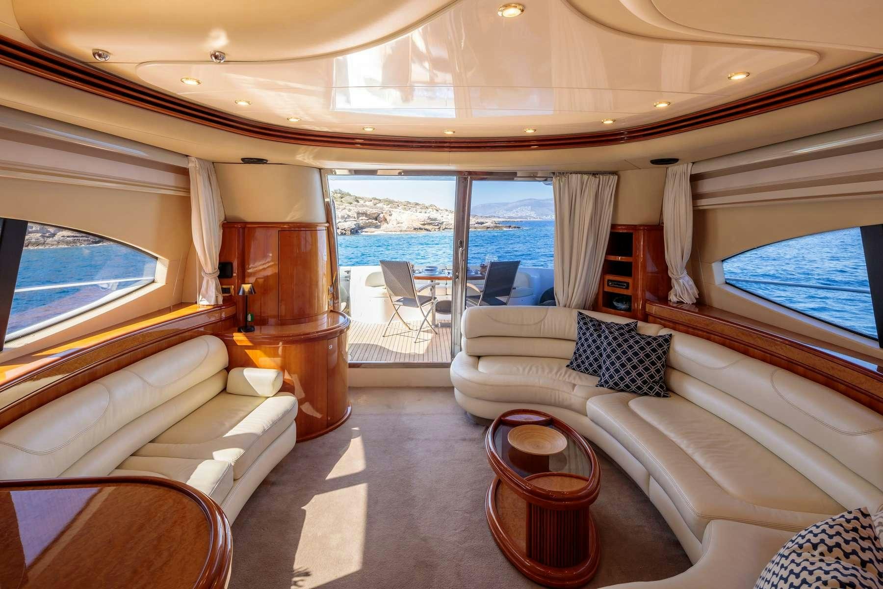 a living room with a large window aboard DREAM Yacht for Charter