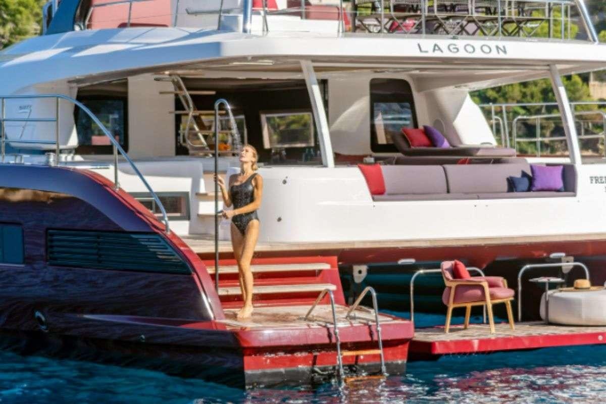 a person standing on a boat aboard VALIUM 67 Yacht for Charter