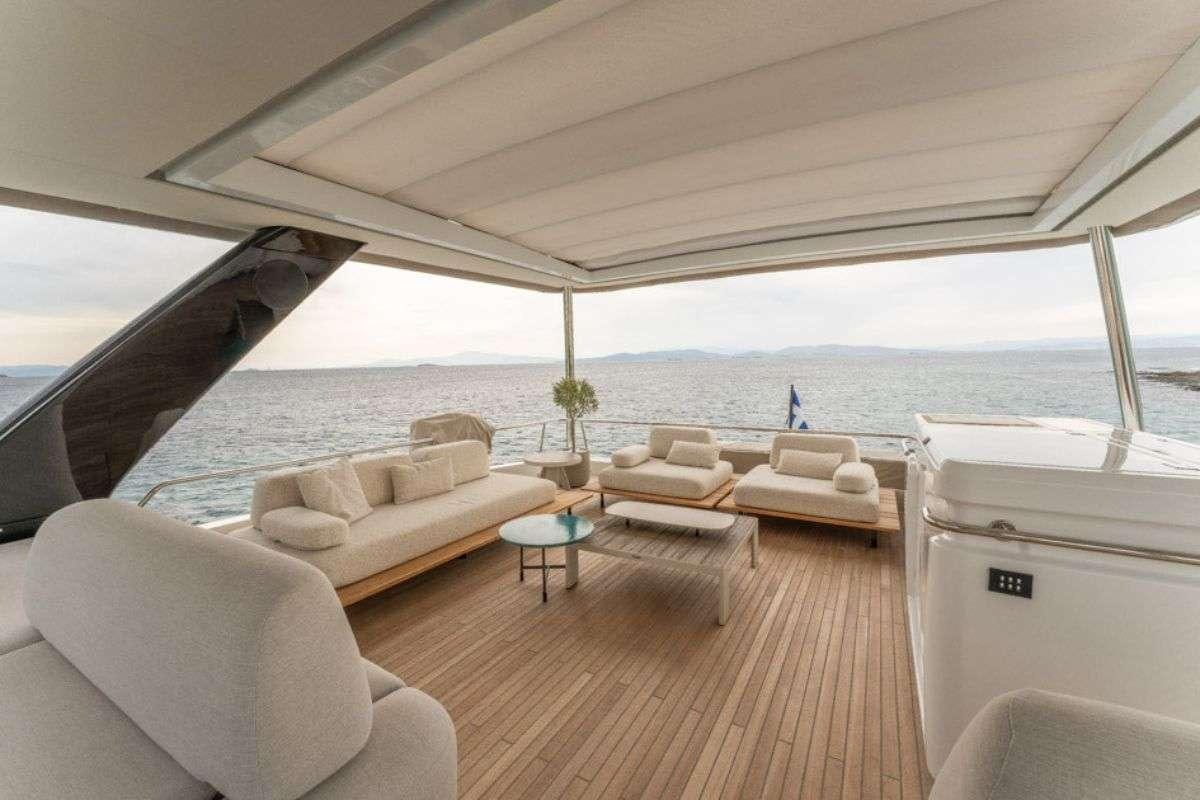 a large living room with a large body of water aboard VALIUM 67 Yacht for Charter