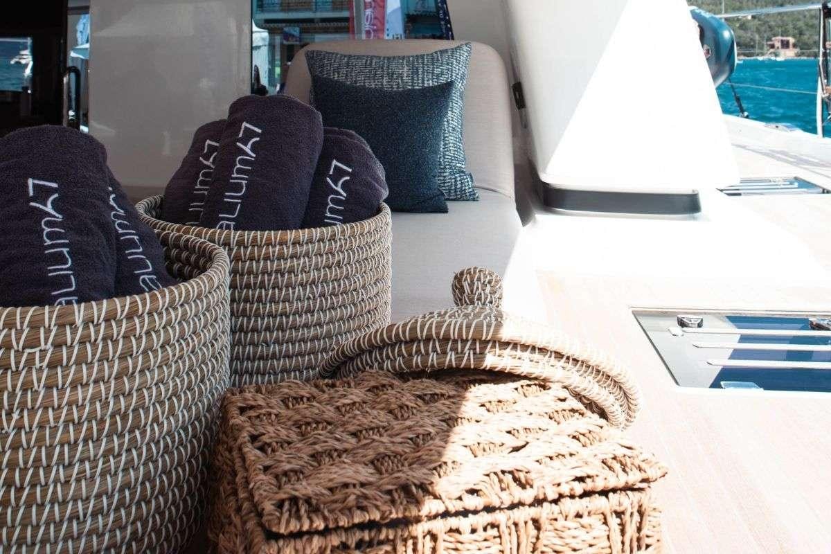 a group of pillows on a table aboard VALIUM 67 Yacht for Charter