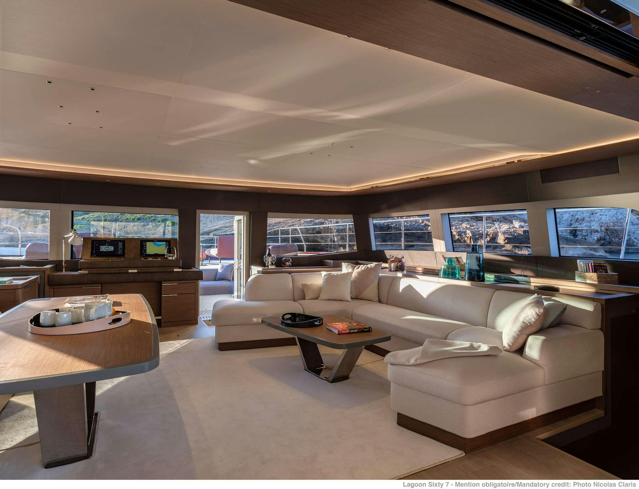 a living room with a large window aboard VALIUM 67 Yacht for Charter