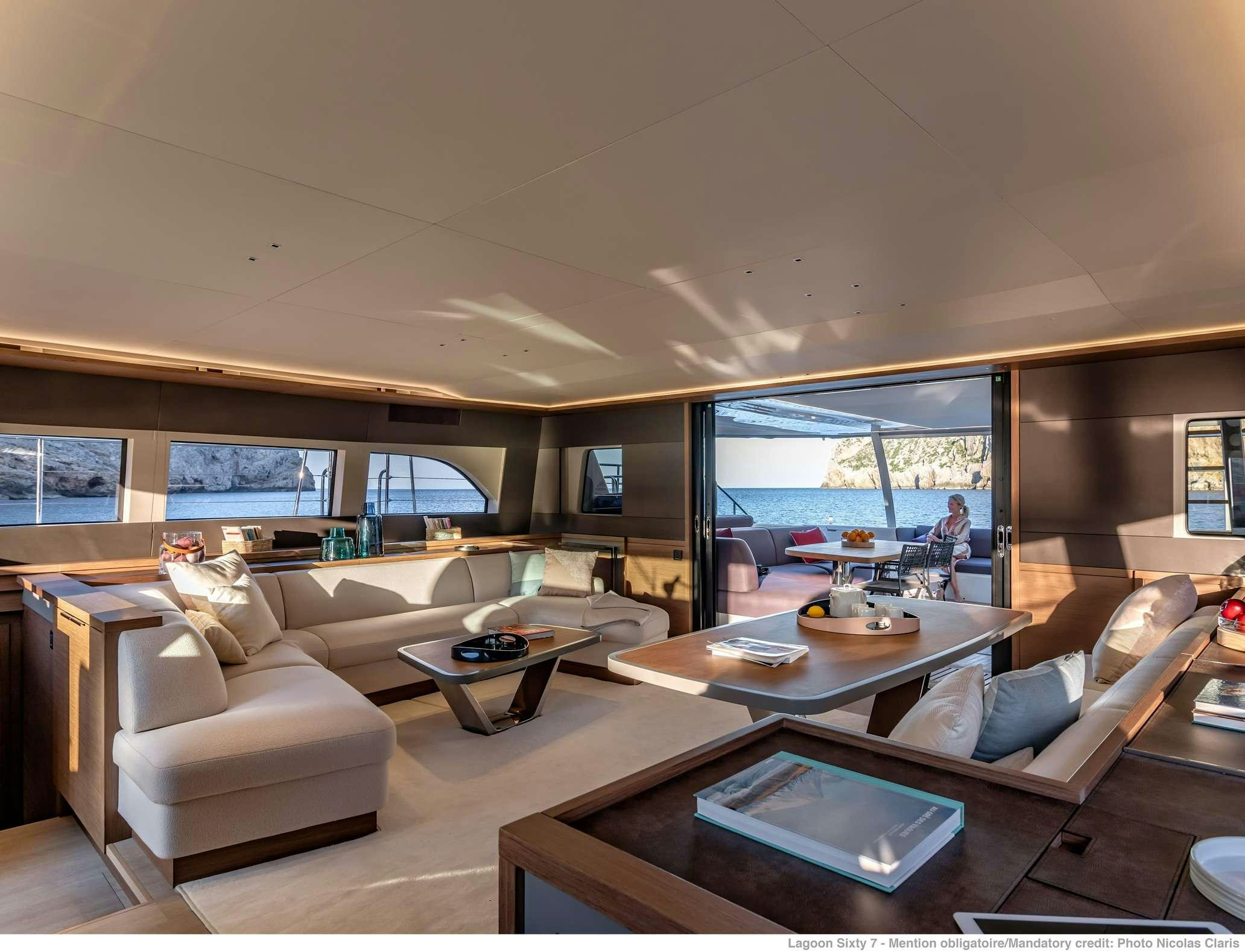 a living room with a large window aboard VALIUM 67 Yacht for Charter