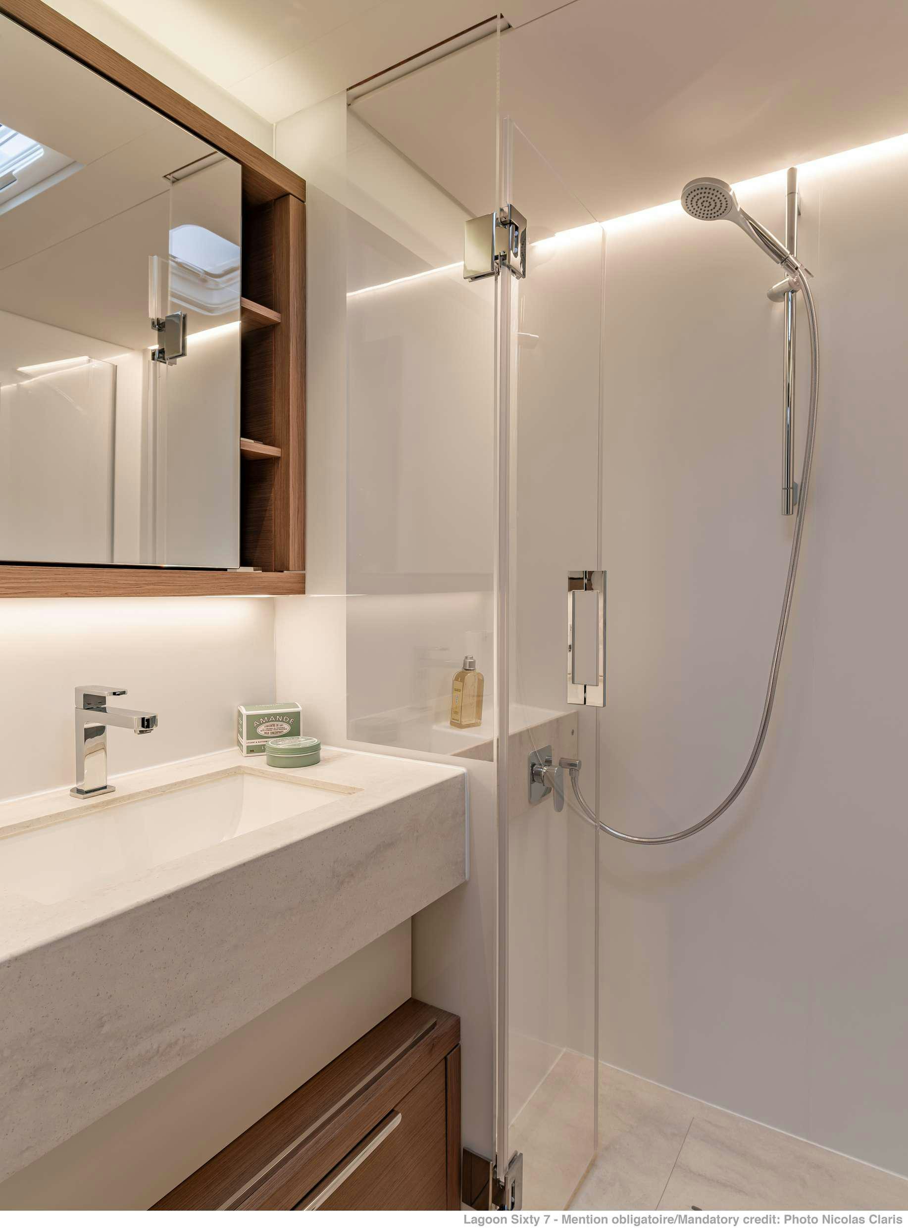 a bathroom with a shower unit and sink aboard VALIUM 67 Yacht for Charter