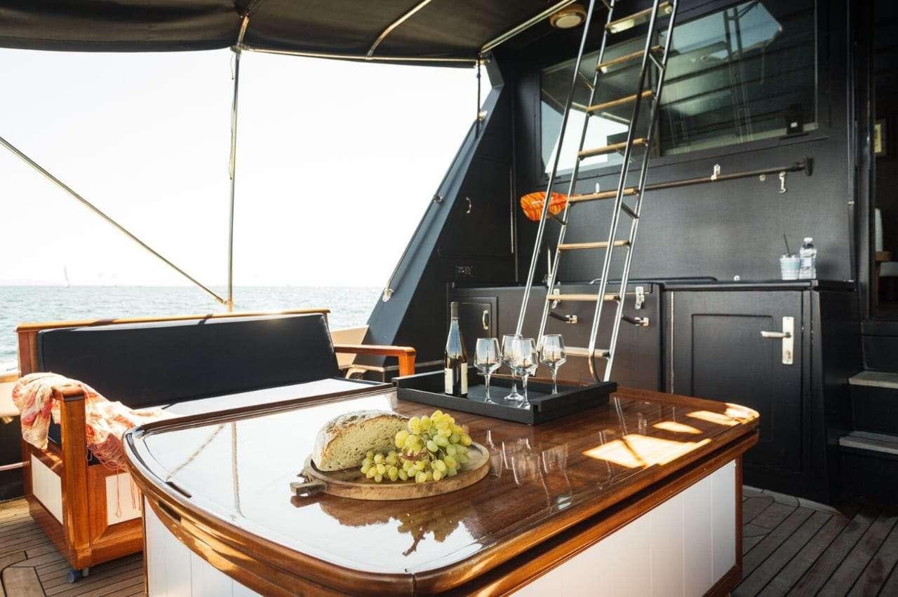 a kitchen with a large window aboard Theoxenia Yacht for Charter