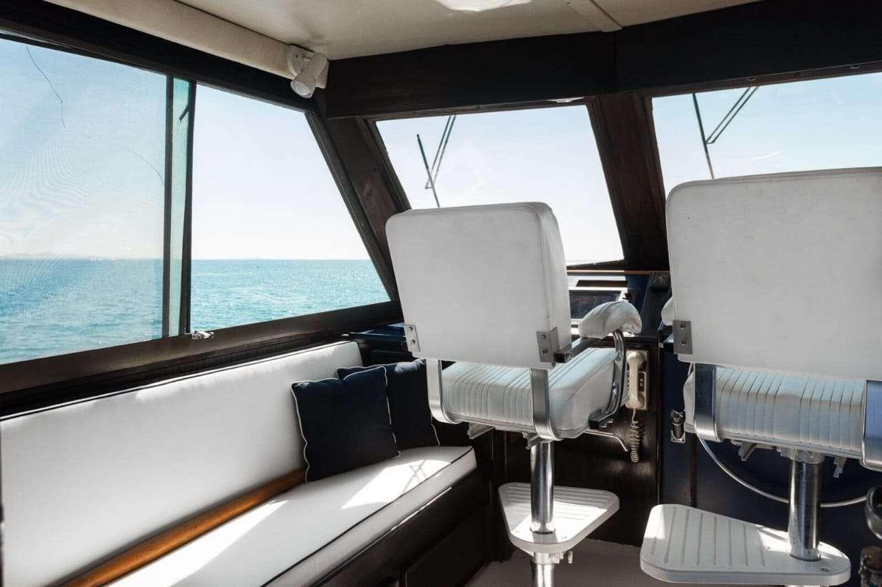 a group of chairs in a boat aboard Theoxenia Yacht for Charter