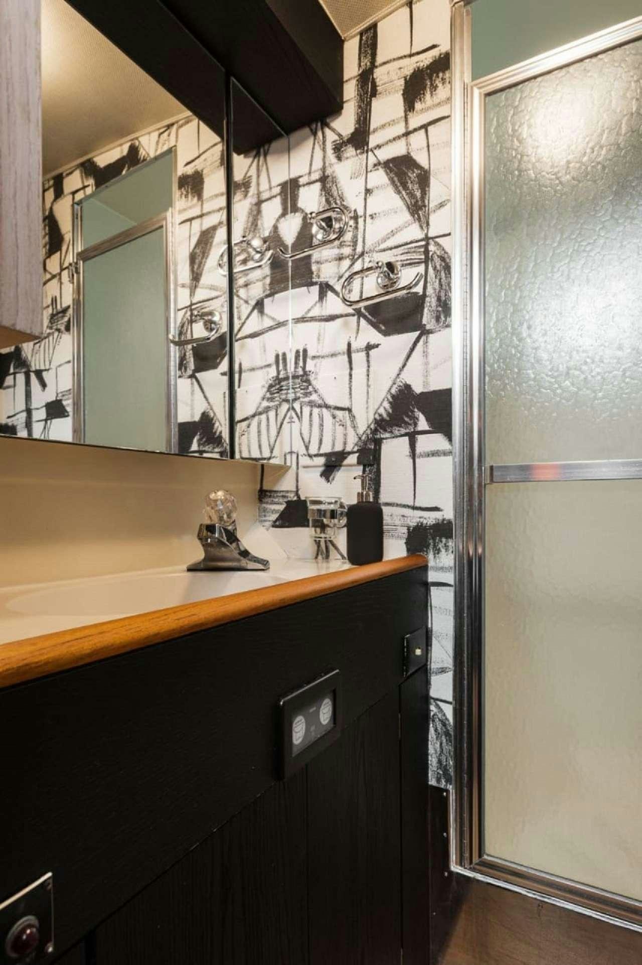 a bathroom with a sink and a mirror aboard Theoxenia Yacht for Charter