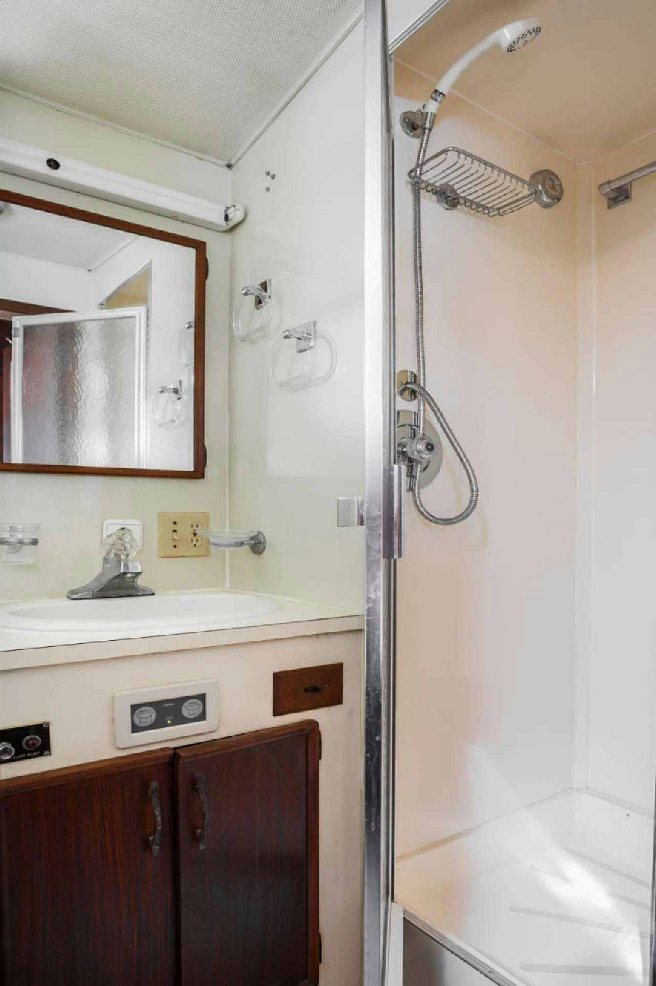 a bathroom with a sink and a mirror aboard Theoxenia Yacht for Charter