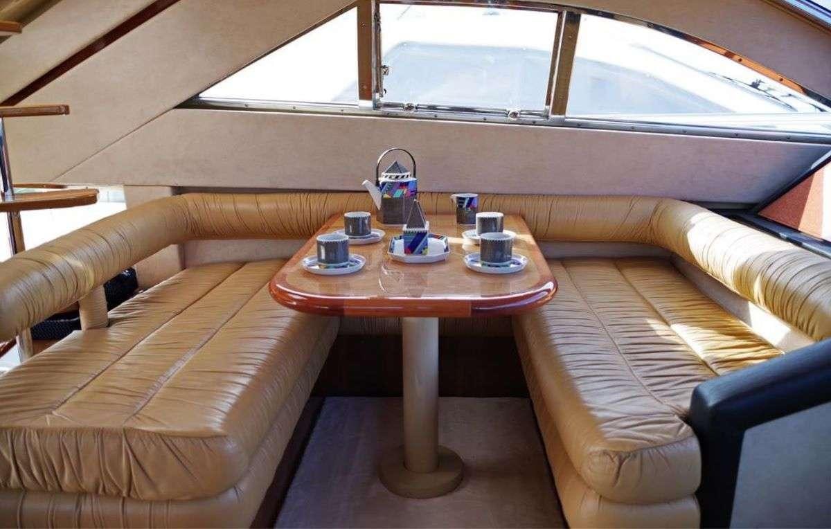a table with cups on it aboard PALMYRA Yacht for Charter