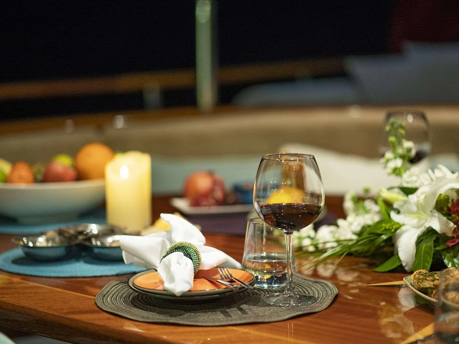 a table with food and glasses on it aboard RIVA Yacht for Charter