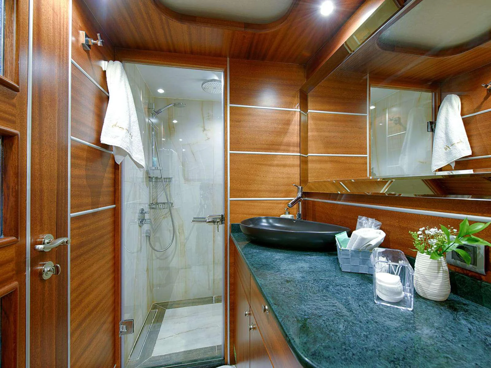 a bathroom with a shower and sink aboard RIVA Yacht for Charter