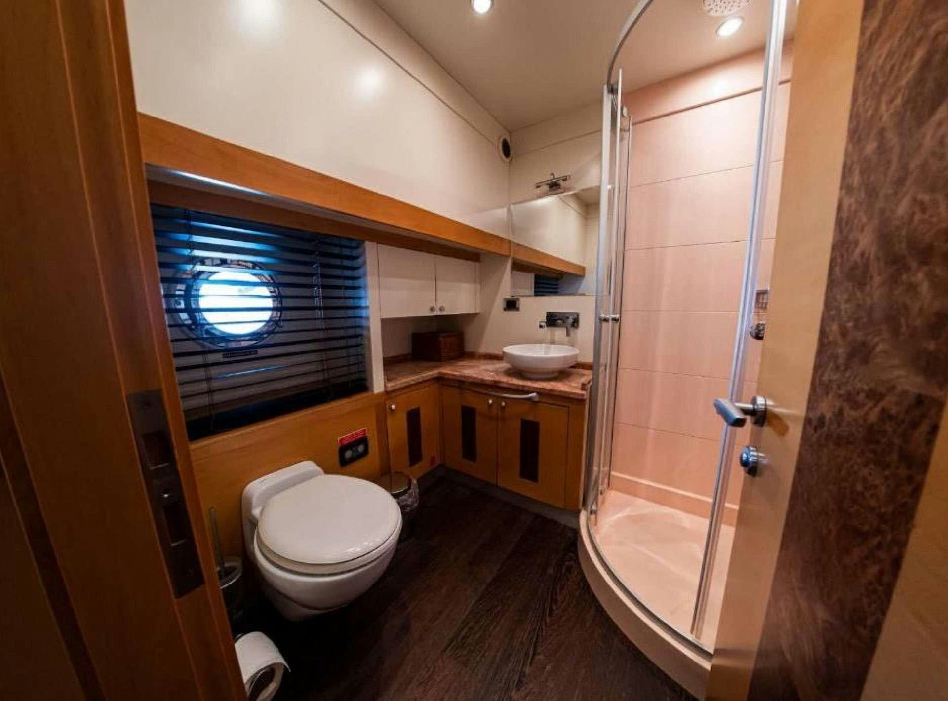 a bathroom with a shower and toilet aboard TIGRA Yacht for Charter