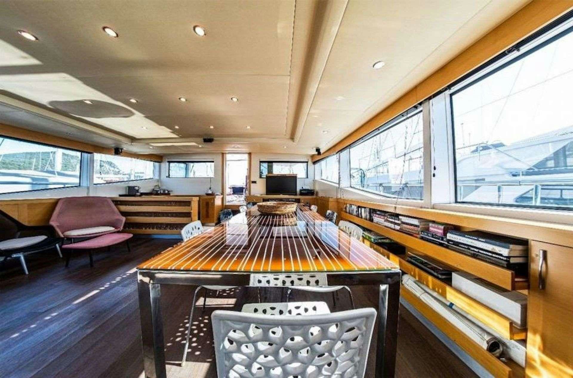a room with a table and chairs aboard TIGRA Yacht for Charter