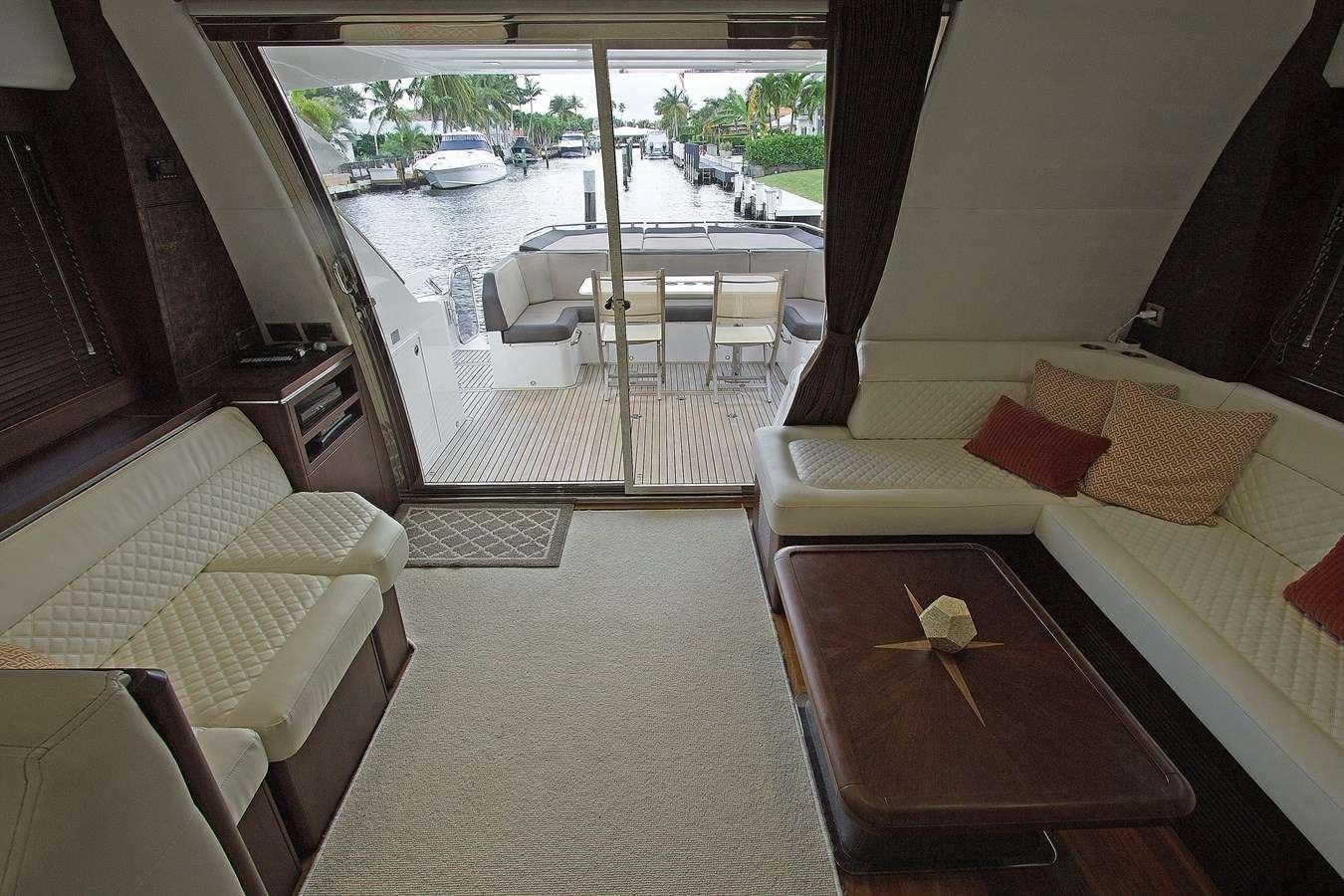 a room with a bed and a table aboard MOODSWING Yacht for Charter