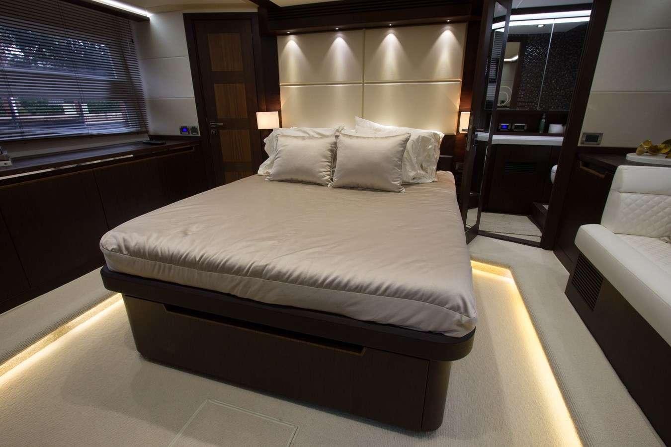 a bed with a white sheet aboard MOODSWING Yacht for Charter
