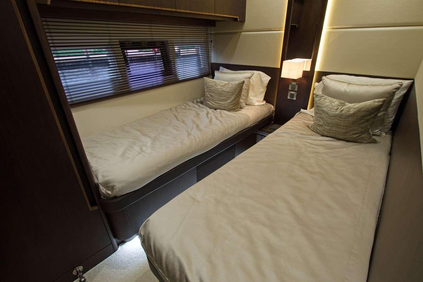 a couple of beds in a hotel room aboard MOODSWING Yacht for Charter