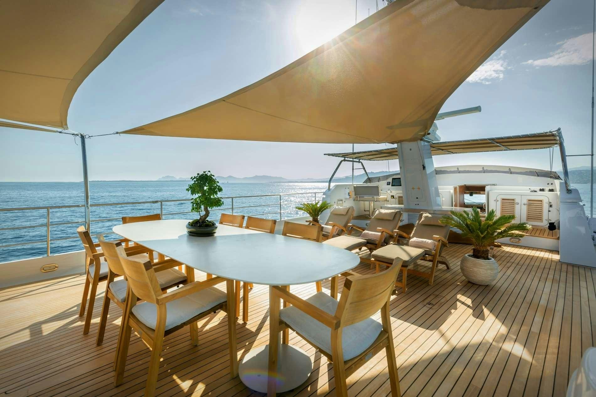 a room with a table and chairs aboard ESPINOLA Yacht for Charter