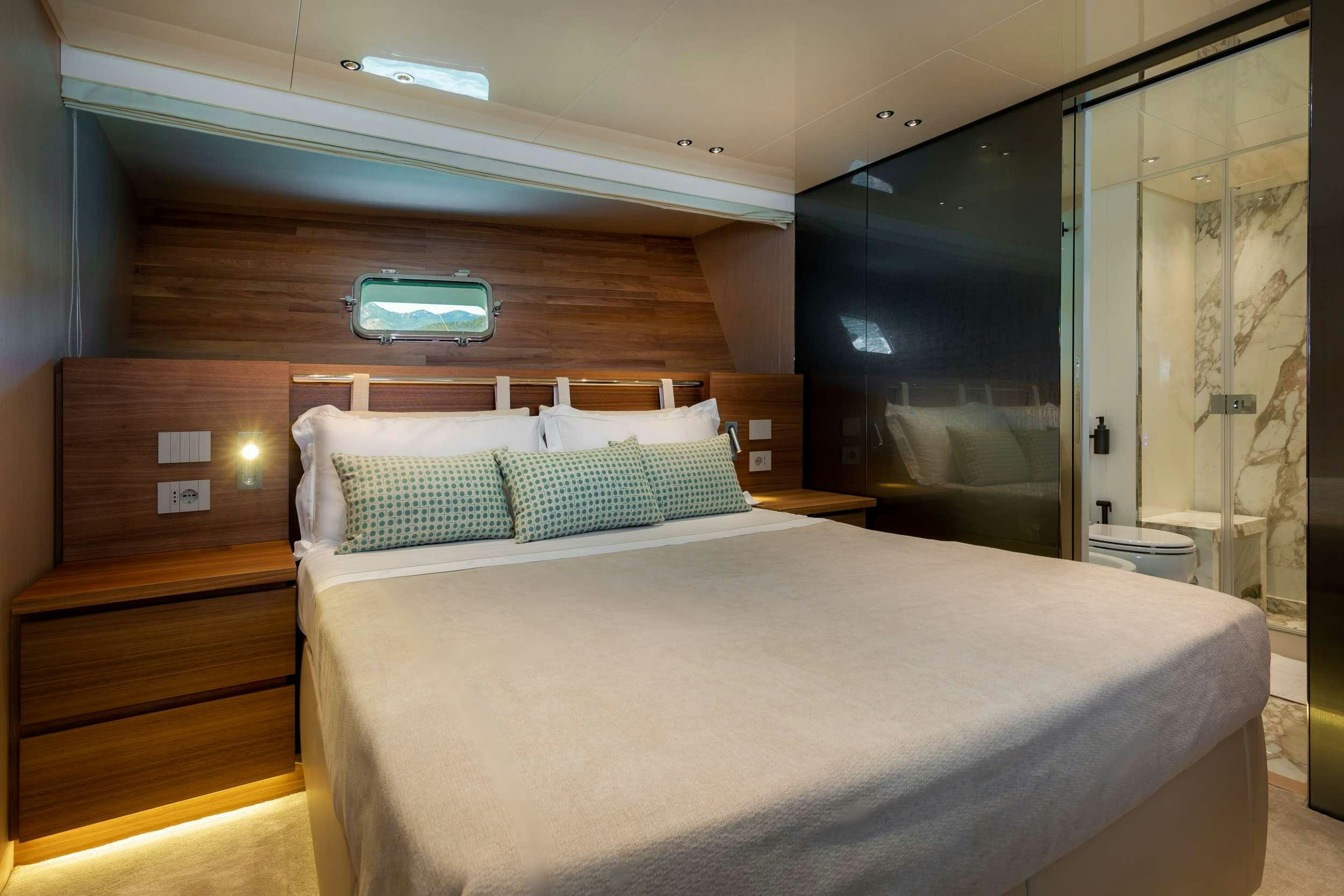 a bed in a room aboard K1 Yacht for Charter