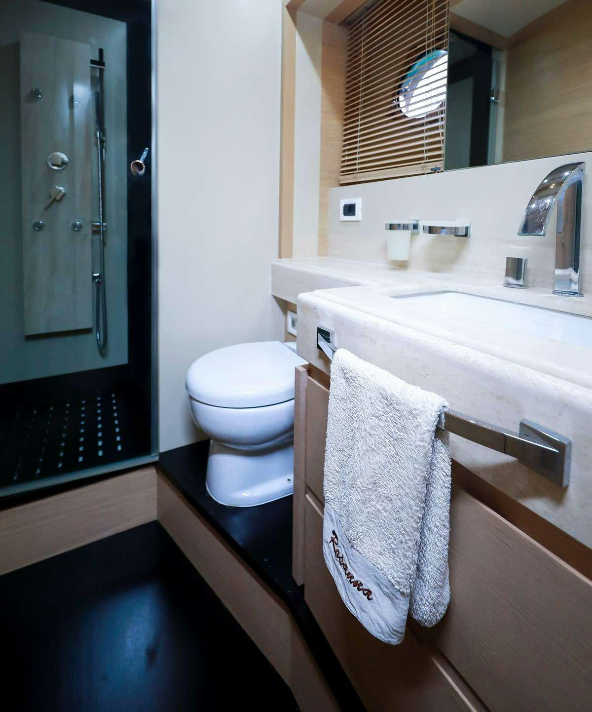 a bathroom with a toilet and a sink aboard FOR EVER ROSANNA Yacht for Charter