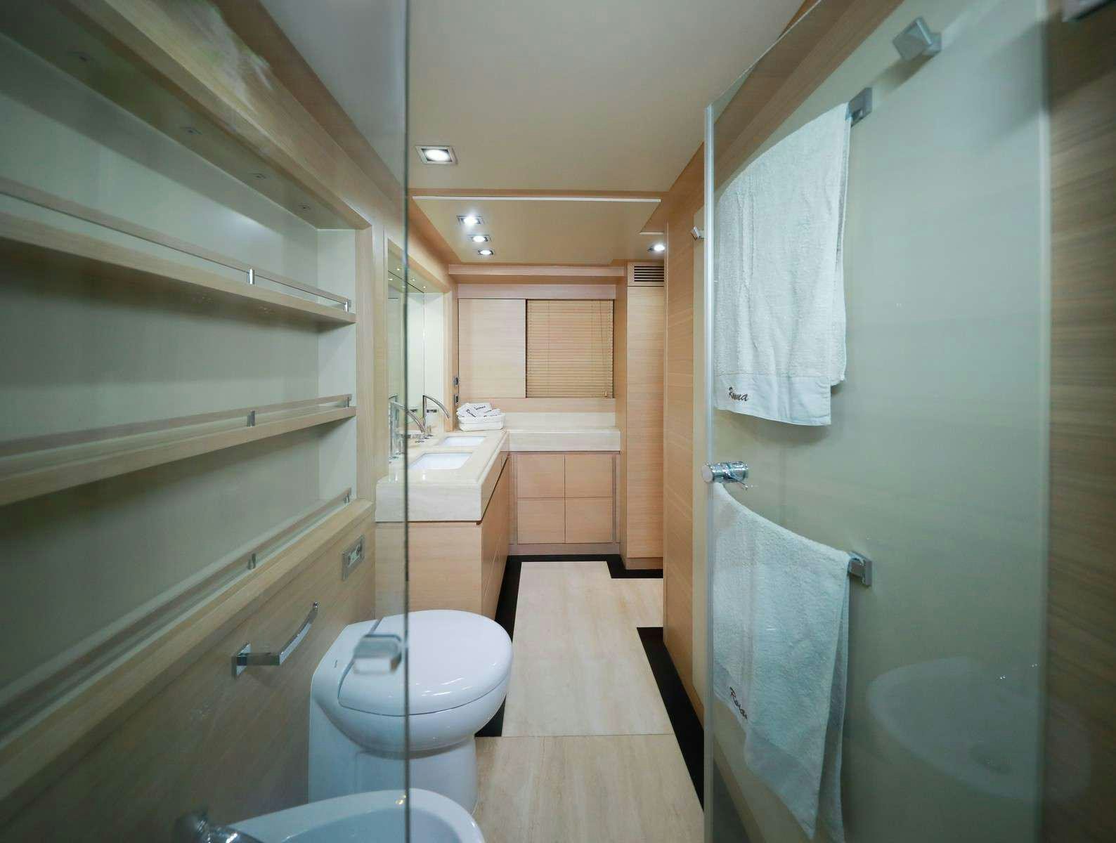 a bathroom with a toilet and sink aboard FOR EVER ROSANNA Yacht for Charter
