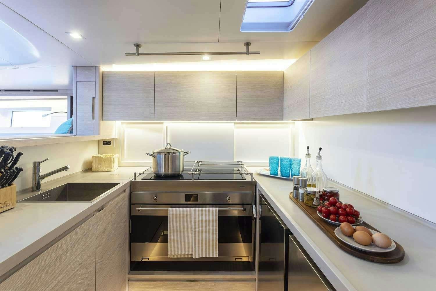 a kitchen with a stove and a sink aboard MINDFULNESS Yacht for Charter